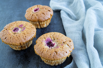 homemade cakes with cherries on a black background