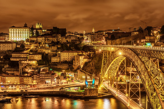 Porto, Portugal: the Dom Luis I Bridge and the old town at night
