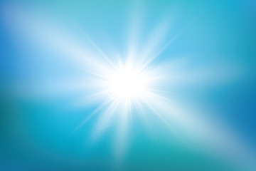 bright sun on blue sky background with lens flare
