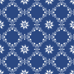 Vector seamless blue pattern with white ornament. Ornate floral decor for textile, wallpaper, pattern fills, covers, surface, print, gift wrap, scrapbooking, decoupage