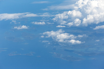 Fototapeta premium View from the wing of the aircraft to the islands of Culion,Galoc,Maglamambay,Popototan, Philippines