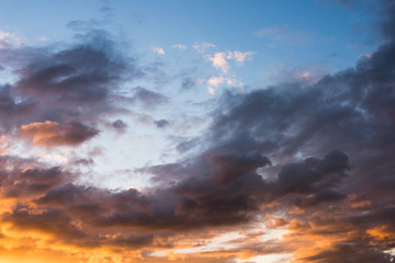 Fototapeta premium Bright orange and yellow colors sunset sky