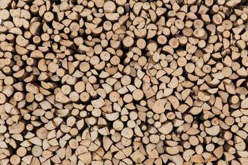 wall firewood, Background of dry chopped firewood logs in a pile.
