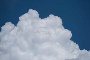 Naklejka na ściany i meble Close-up white cloud with blue sky for nature background