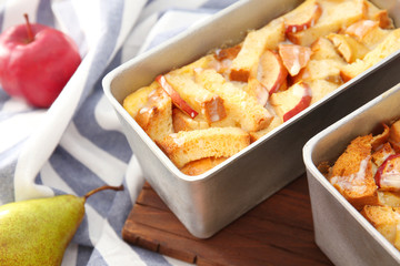 Freshly baked bread pudding in casserole dish, closeup