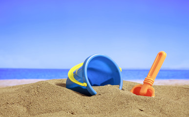 Summer vacations - Bucket on a sandy beach