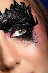 woman eye with black paper zigzag make-up.Fashion makeup.Creative makeup.closeup