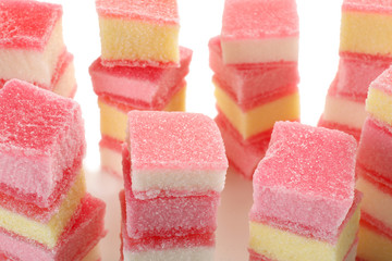 Tasty jelly candies on white background, closeup