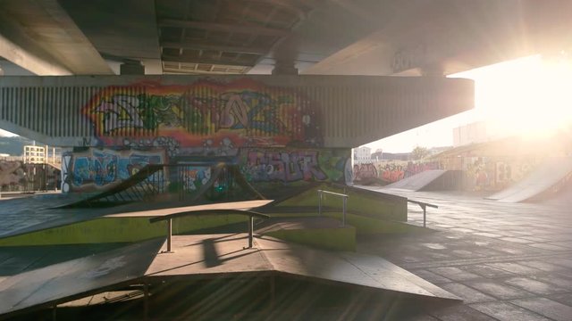 Two people rollerblading. Guys on inline skates outdoor. Friends in skatepark.