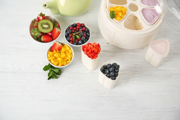 Composition with tasty homemade yogurt and ingredients on light wooden table