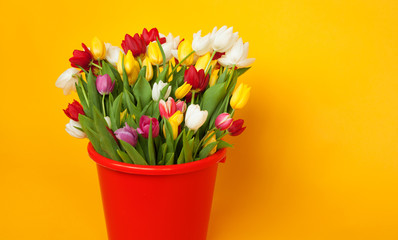 Different colored flowers in basket