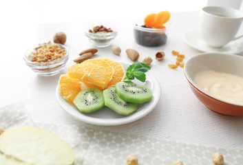 Composition with tasty yogurt on kitchen table