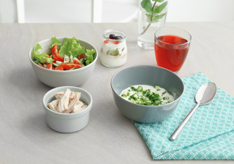 Composition with tasty yogurt on kitchen table © Africa Studio