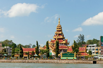 Myanmar border pier. Buddhist temple at seafront