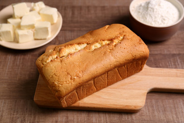 Delicious butter cake on table in kitchen