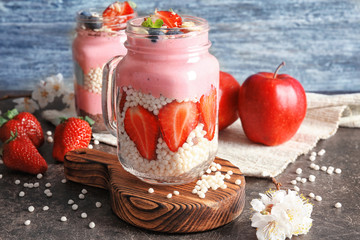 Obraz na płótnie Canvas Delicious parfait with fruits in jar on table