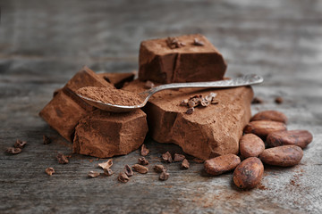 Composition of cocoa products on wooden background