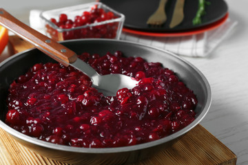 Delicious cranberry sauce on kitchen table