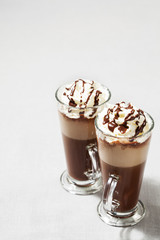Refreshing iced coffee drink with whipped cream: freddoccino, frappuccino
