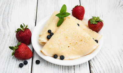 crepes with strawberries and blueberries