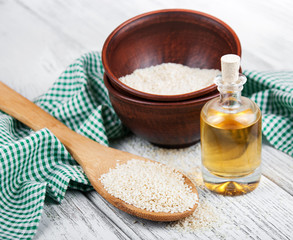 Sesame seeds and bottle with oil