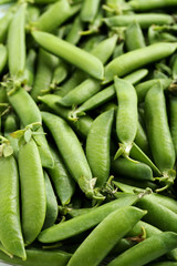 Fresh green peas background, close up