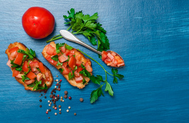 Italian food, tomato bruschetta. Top view with space for text.