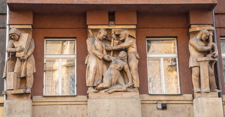 Fototapeta na wymiar Ancient sculptures decorate one of the houses in Prague