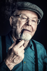 grandfather smokes a pipe