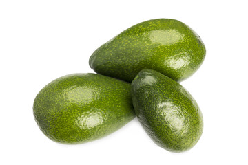 Three whole avocados isolated on white background.