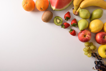 Fruits on a white table diagonal top view