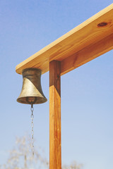 Old fire metal bell on a wooden structure.