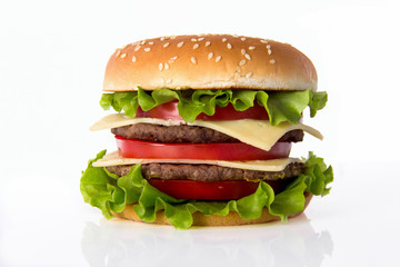 Hamburger with meat, cheese and fresh vegetables.