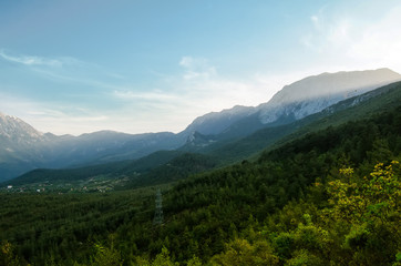 Fototapeta premium Mountain and green forest with valley on the landscape view.