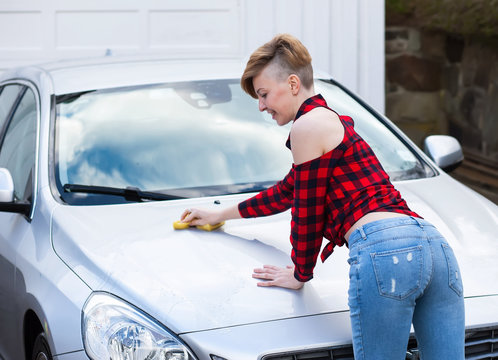 Girl wash a car