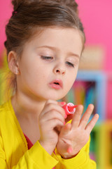 Beautiful girl paints her nails