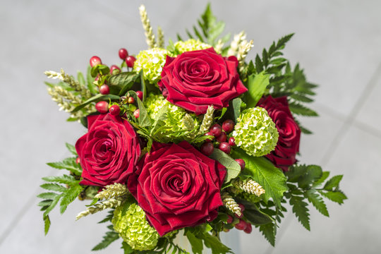 Some Red Bright Roses Flowers On A Green Bouquet Love Gift