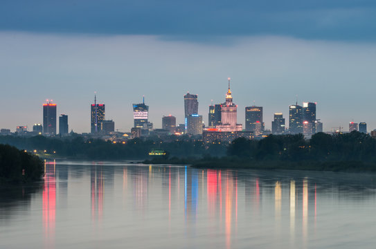 Night panorama of Warsaw skyline, Poland, over Vistula river in the night