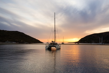 Fabulous Sunset in Kolona double bay, Kythnos, Cyclades, Greece. Sailboats