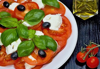 Caprese salad. Classic caprese salad. Italian traditional caprese salad ingredients. Mediterranean food.