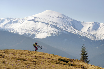 Fototapeta premium rider among fantastic snow peaks