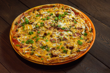 Pizza, on a dark wood background