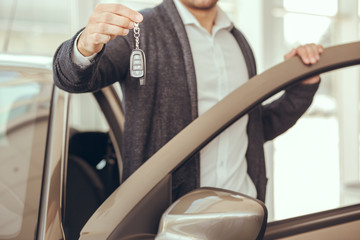 Young Man in a Car Rental Service Test Drive Concept