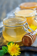 Glass jar with linden honey.