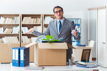 Man moving office with box and his belongings