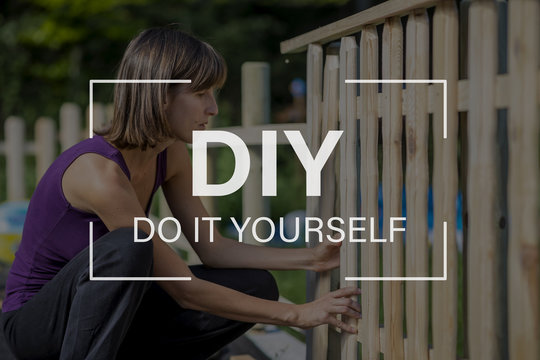 DIY Concept With A Woman Building A Garden Fence