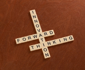 Crossword puzzle with words Innovation, Forward, Thinking. Innovate concept.