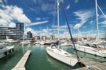 Fototapeta premium Luxury yachts and apartments at Southampton's Ocean Village marina
