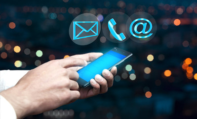Businessman using phone and  digital interface