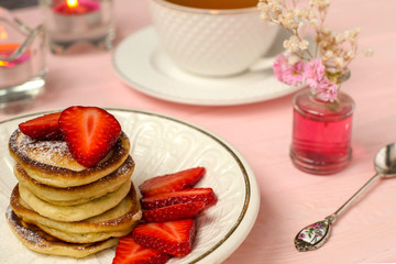 Pancakes stack with strawberry slices